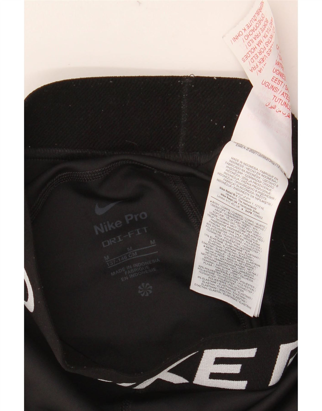 NIKE Girls Dri Fit Graphic Leggings 10-11 Years Medium Black Polyester