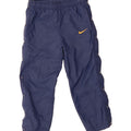 NIKE Boys Tracksuit Trousers 8-9 Years Small Navy Blue Polyester Vintage Nike and Second-Hand Nike from Messina Hembry 
