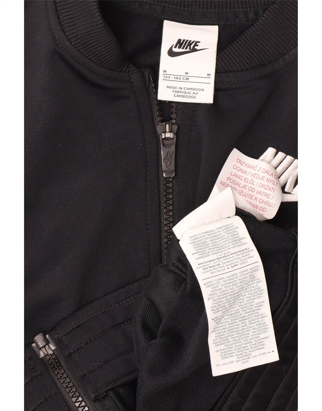 NIKE Girls Graphic Tracksuit Top Jacket 10-11 Years M Black Polyester Vintage Nike and Second-Hand Nike from Messina Hembry 