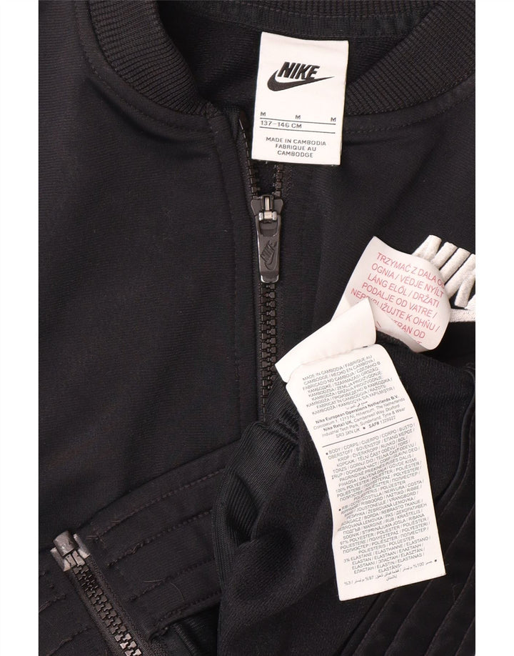 NIKE Girls Graphic Tracksuit Top Jacket 10-11 Years M Black Polyester Vintage Nike and Second-Hand Nike from Messina Hembry 